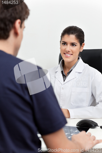 Image of Female Doctor Talking to Patient