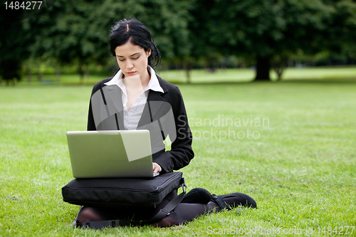 Image of Businesswoman Working on Laptop