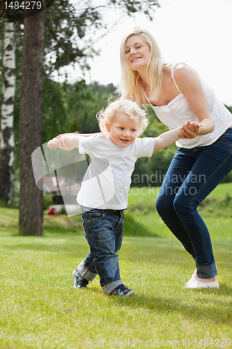 Image of Baby boy learning to walk