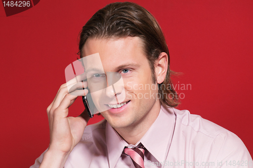 Image of Businessman talking on a cell phone