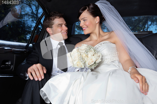 Image of Couple in a luxurious car