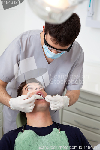 Image of Dentist Casting Mold from Patient