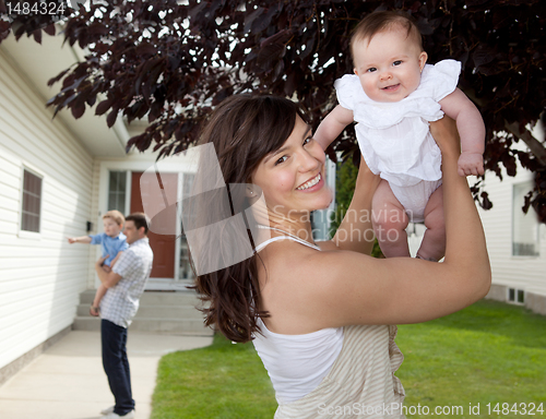 Image of Mother and Daughter with House