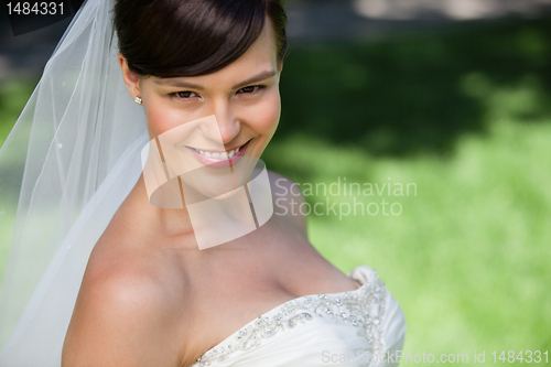 Image of Attractive young bride smiling