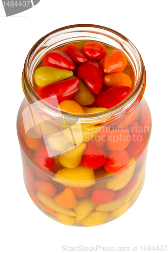 Image of canned peppers in a glass jar isolated on white background