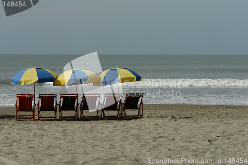 Image of chaise lounges on pacific ocean