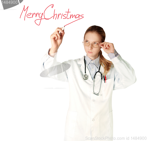 Image of doctor woman writting Merry Christmas