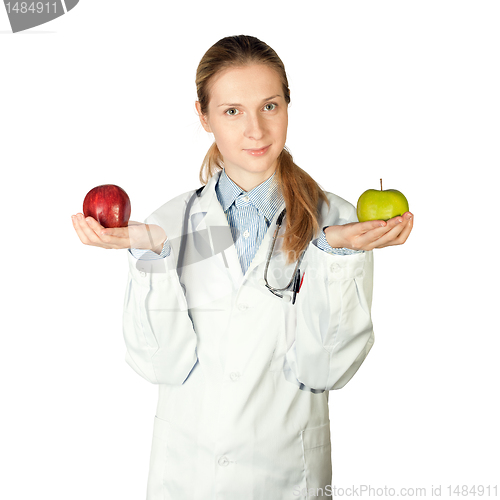 Image of female doctor with two apples