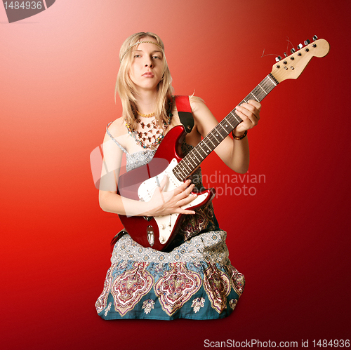 Image of hippie girl with the guitar