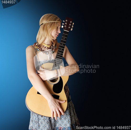 Image of hippie girl with the guitar