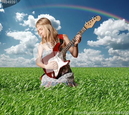 Image of hippie girl with the guitar outdoor