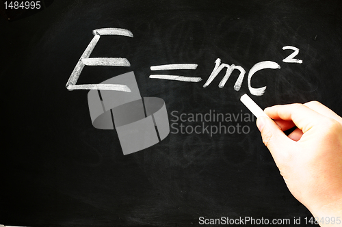 Image of E=mc² Albert Einsteins physical formula on blackboard 