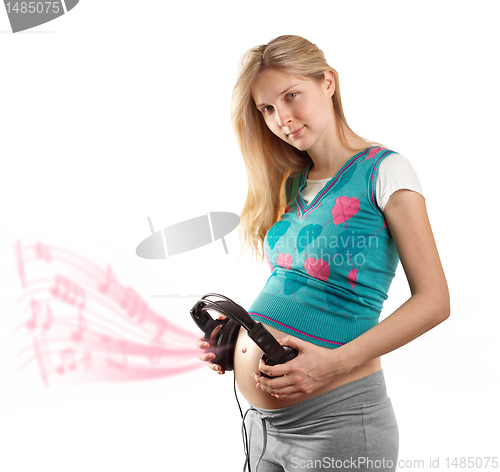 Image of pregnant female with headphones