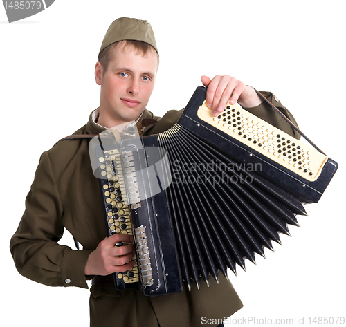 Image of A soldier plays the accordion