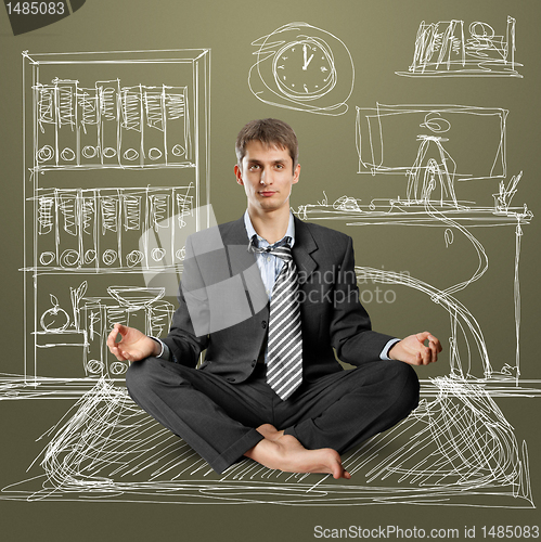 Image of businessman in lotus pose