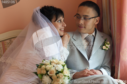 Image of The bride and groom in their room before the wedding