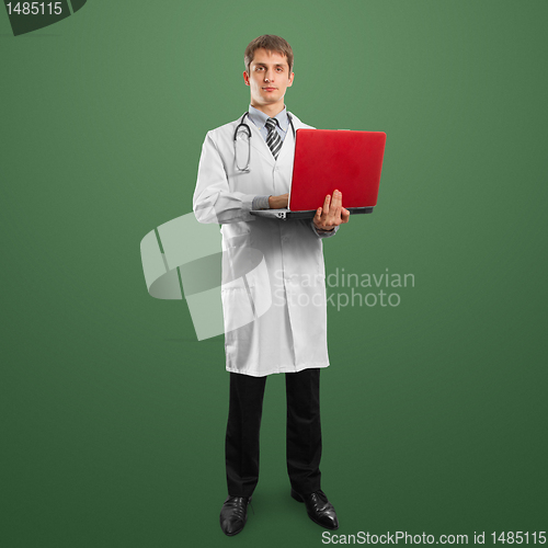 Image of doctor male in suit with laptop in his hands