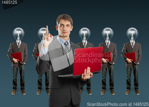 Image of lamp head businesspeople with laptop