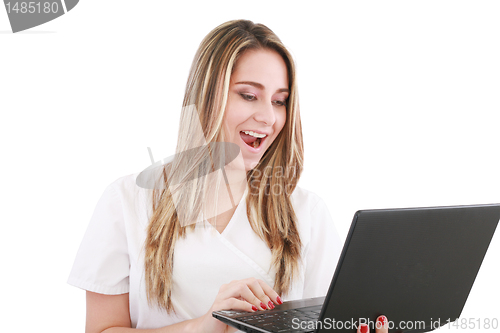 Image of A woman doctor is surprised and looking at her laptop. 