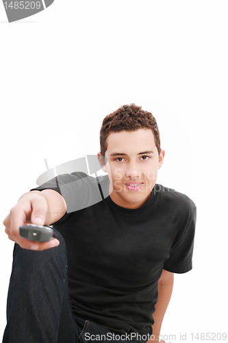 Image of Teenage boy with TV remote control