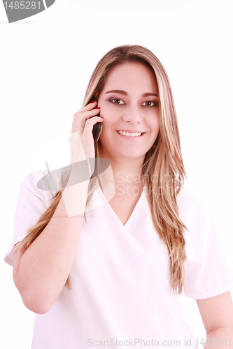 Image of Young beautiful woman-nurse talks by mobile phone, isolated on w