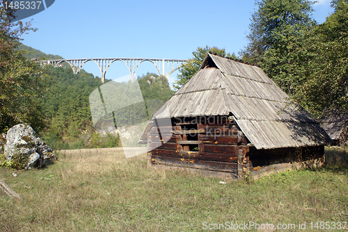 Image of Wooden hut and bridge