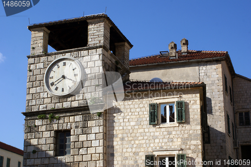 Image of Clock tower and house 