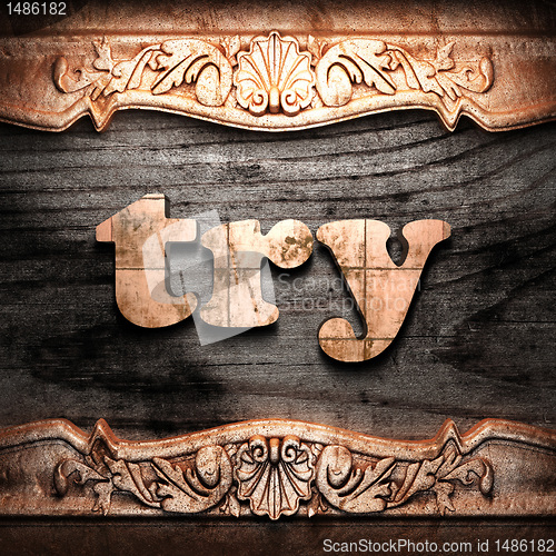 Image of Golden word on wood