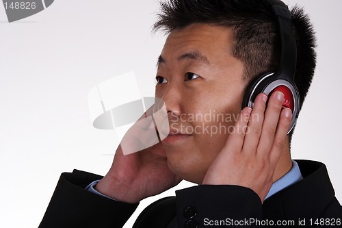 Image of Asian businessman listening