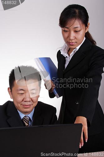 Image of Asian Executive and Secretary