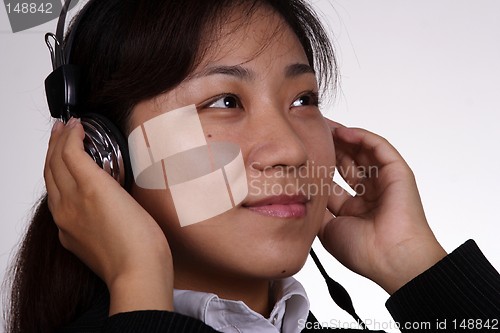 Image of Asian businesswoman listening