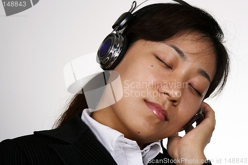 Image of Asian businesswoman listening