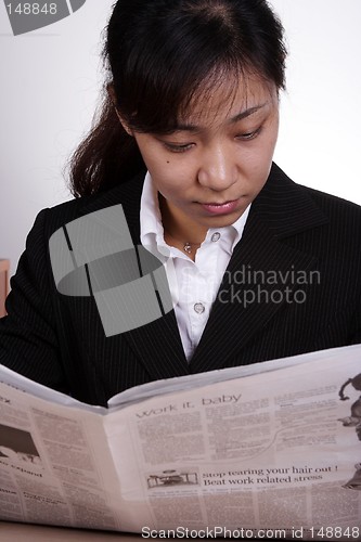 Image of Asian Businesswoman Reading