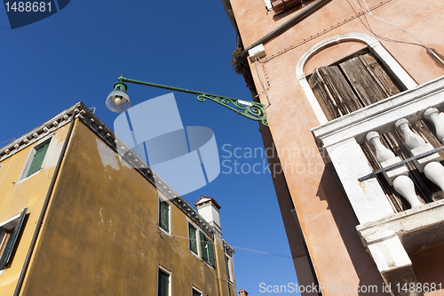 Image of Street lamp between buildings, Venice.