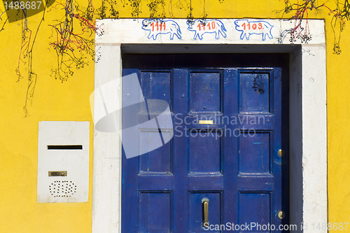 Image of Blue door and yellow wall