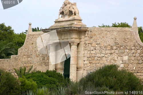 Image of large old wall with a gate in it