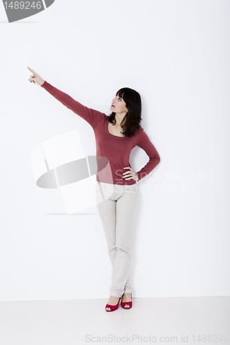 Image of Beautiful woman standing and pointing