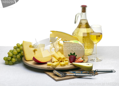 Image of Cheese still life on a wooden round tray