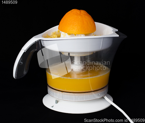 Image of Citrus Juicer and oranges