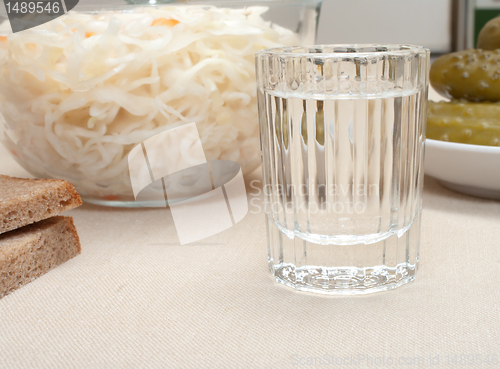 Image of Vodka and snack.