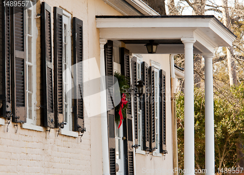 Image of Cream colored house with xmas wreath