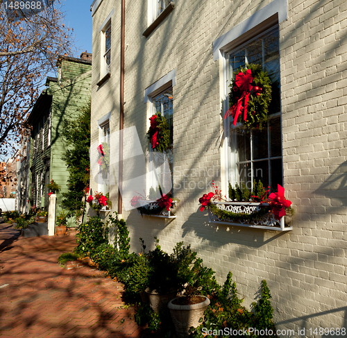 Image of Cream colored house with xmas wreath