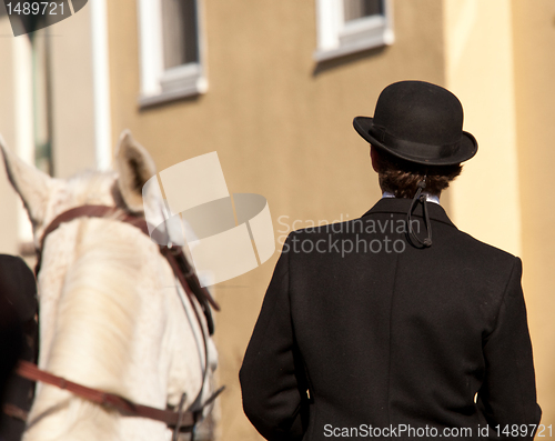 Image of Kentucky riding hat on man