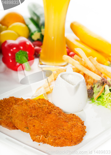 Image of classic Milanese veal cutlets and vegetables