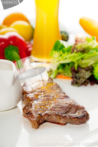 Image of juicy BBQ grilled rib eye ,ribeye steak and vegetables