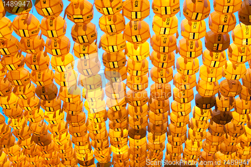 Image of Yellow paper lanterns in buddhist temple