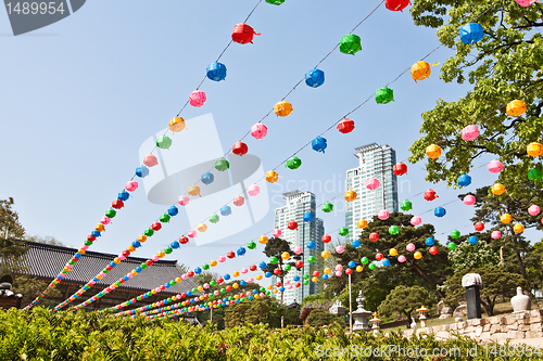 Image of Colorful lanterns hanging near buddhist temple