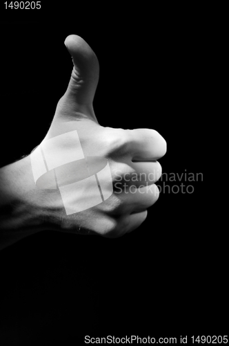Image of Hand fingers with upped big one foto