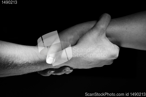 Image of Hands unite with eachother as friends greeting