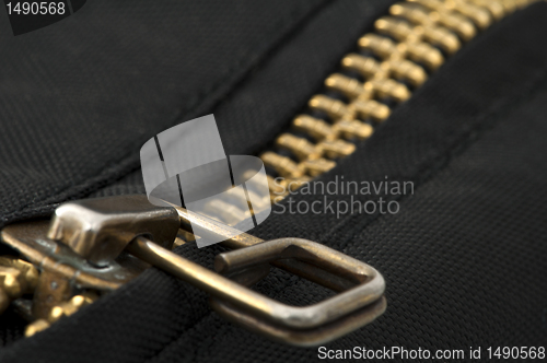 Image of Closed yellow metal zipper